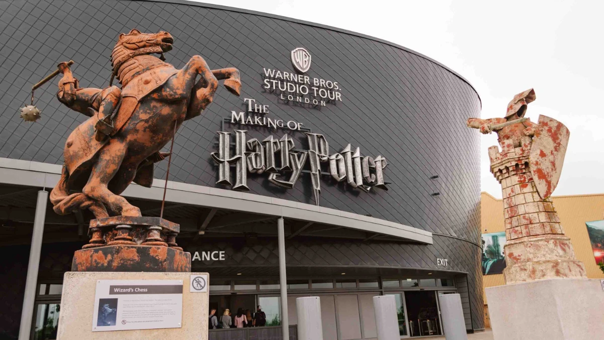Entrance to the Warner Bros. Studio Tour London – The Making of Harry Potter, featuring large Wizard’s Chess statues from the movie.