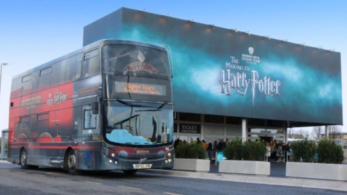 A themed bus of Harry Potter studio tour London with the banner of the studios
